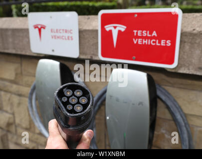 A general view of a Tesla electric car charging station in Belfast. Stock Photo
