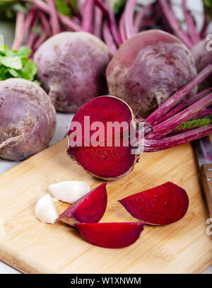 Red Beetroot with herbage green leaves on wooden background Stock Photo