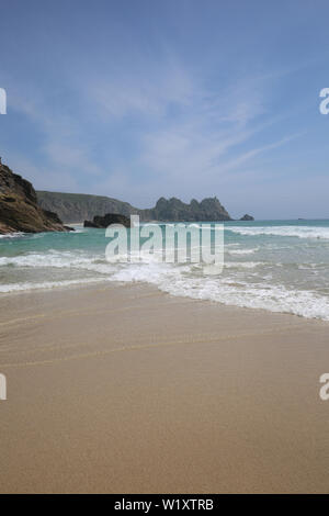 sea fog clearing Porthcurno beach idyllic morning Stock Photo