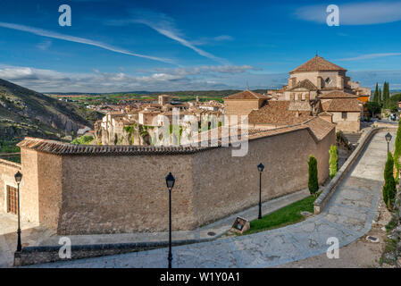 Wall around Convento de las Camelitas, Iglesia de San Pedro in distance, view from Calle Trabuco in Old Town at Cuenca, Castile-La Mancha, Spain Stock Photo