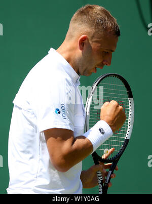 Dan Evans celebrates during his match on day four of the Wimbledon Championships at the All England Lawn Tennis and Croquet Club, London. Stock Photo