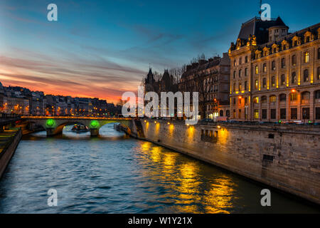 Evening view of the Palais De Justice from the Seine River in Paris, France. Stock Photo