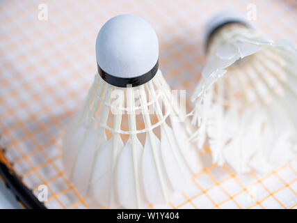 white badminton shuttlecocks lay on white table background Stock Photo