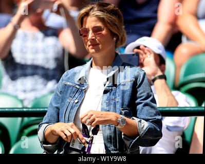 Mirka Federer watches her husband Roger Federer on day four of the Wimbledon Championships at the All England Lawn Tennis and Croquet Club, Wimbledon. Stock Photo