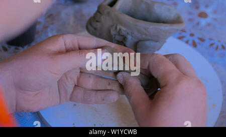 Man making mug in pottery studio workshop Stock Photo