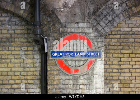 Weathered Roundel at Great Portland Street underground station, London, UK Stock Photo