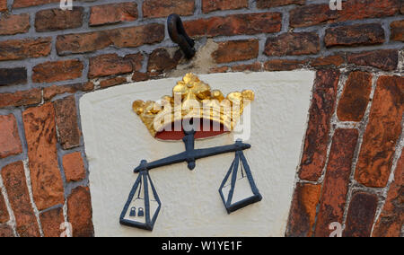 leer, niedersachsen/germany - may 17, 2015: a scale relief symbol above the entrance of the historic weigh house Stock Photo