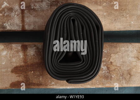bicycle wheel camera on wooden background Stock Photo