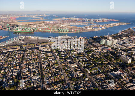 Afternoon aerial view of San Pedro area streets, homes and harbor waterfront facilities in Los Angeles County California. Stock Photo