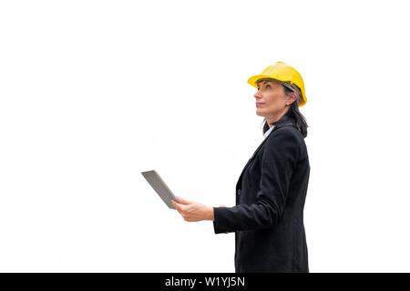 Leader of woman engineer with helmet stand holding laptop on white background Stock Photo
