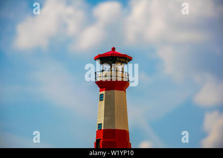 Bokeh of a minature lighthouse against the blue sky. Stock Photo