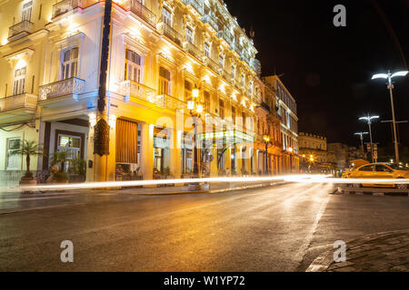 Havana, Cuba - May 27, 2019: Beautiful view of the streets of Old Havana City during a vibrant night after sunset. Stock Photo