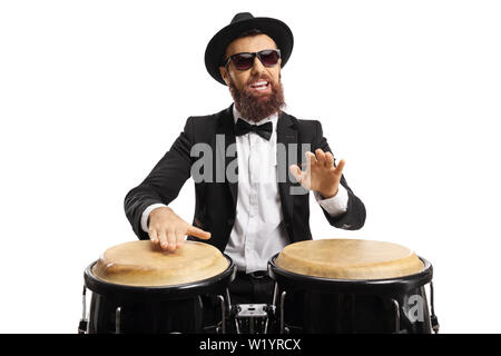 Portrait of a man in a suit playing conga drums isolated on white background Stock Photo