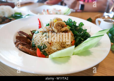 fried rice or stir-fried rice with crispy pork, duck and vegetable Stock Photo