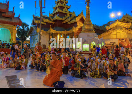 People praying in the Shwedagon pagoda Stock Photo