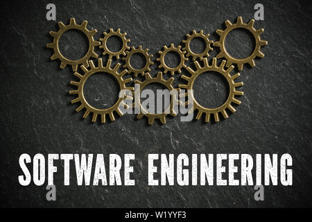 cogwheels and the words "software engineering" on slate background symbolizing a complex system working together Stock Photo