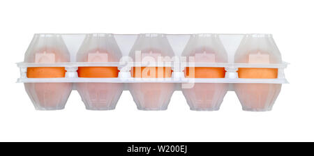Raw brown chicken eggs in closed white semitransparent plastic packaging isolated on white background Stock Photo