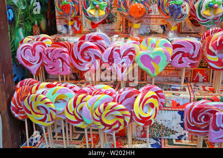Christmas lollipops of different colors, flavors and shapes at the Christmas market Stock Photo