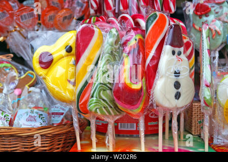 Christmas lollipops of different colors, flavors and shapes at the Christmas market Stock Photo
