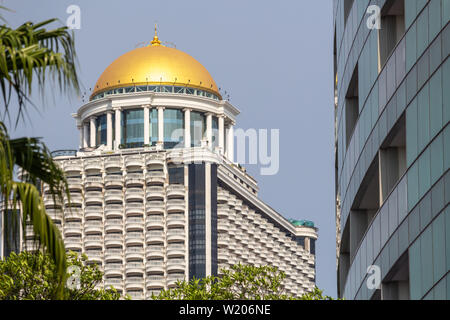 Bangkok, Thailand - April 14, 2019: State tower skyscraper with golden dome Stock Photo