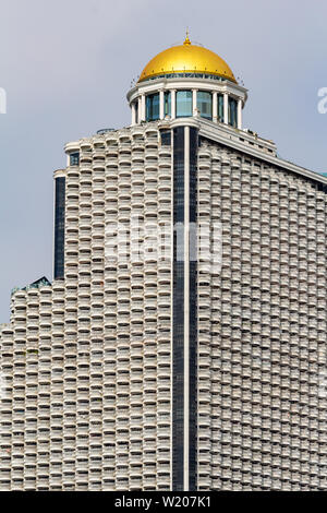 Bangkok, Thailand - April 14, 2019: State tower skyscraper with golden dome Stock Photo