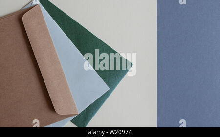 Colorful envelopes and cardboards on table. Mockup. Office concept. Stock Photo