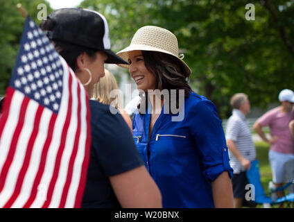 Amherst, NH, USA. 4th July, 2019. Presidential candidates marched in the 4th of July parade on July 4, 2019 in Amherst New Hampshire. They all were campaigning to voters for support. Candidate tulsi Gabbard marches in the parade. Credit: Allison Dinner/ZUMA Wire/Alamy Live News Stock Photo