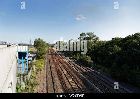 Margam, Wales, UK. 3rd July, 2019. The tracks where the stranded train is located near Margam in south Wales, UK. Wednesday 03 July 2019 Re: Two rail workers have died after being hit by a passenger train between Port Talbot Parkway and Bridgend stations in south Wales, UK. The pair were struck near Margam by the Swansea to London Paddington train at about 10am. They were pronounced dead at the scene and a third person was treated for shock, but was not injured. Credit: ATHENA PICTURE AGENCY LTD/Alamy Live News Stock Photo