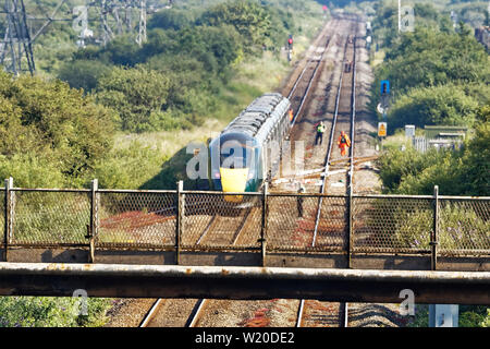 Margam, Wales, UK. 3rd July, 2019. The stranded train on the tracks near Margam in south Wales, UK. Wednesday 03 July 2019 Re: Two rail workers have died after being hit by a passenger train between Port Talbot Parkway and Bridgend stations in south Wales, UK. The pair were struck near Margam by the Swansea to London Paddington train at about 10am. They were pronounced dead at the scene and a third person was treated for shock, but was not injured. Credit: ATHENA PICTURE AGENCY LTD/Alamy Live News Stock Photo