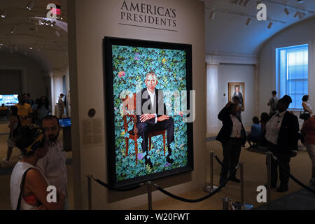 Visitors look at a painting of President Barack Obama by artist Kehinde Wiley at the National Portrait Gallery in Washington, D.C.