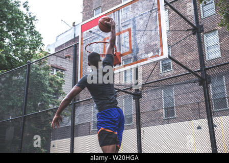 Basketball player training on a court in New york city