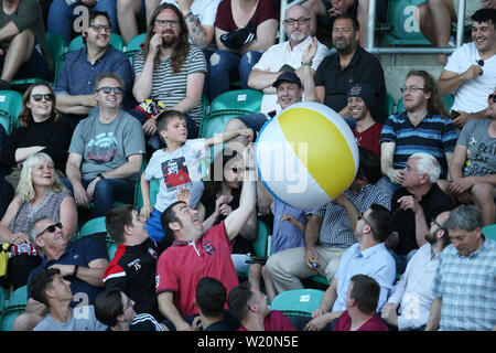 Cardiff, UK. 04th July, 2019. fans in the crowd play with a large beach ball. UEFA Europa league preliminary qualifying round match, 2nd leg, Cardiff Metropolitan University (Wales) v FC Progres Niederkorn (Luxembourg) at Cardiff International Sports campus Stadium in Cardiff, South Wales on Thursday 4th July 2019. Editorial Usage Only. pic by Andrew Orchard/Andrew Orchard sports photography/Alamy Live News Credit: Andrew Orchard sports photography/Alamy Live News Stock Photo