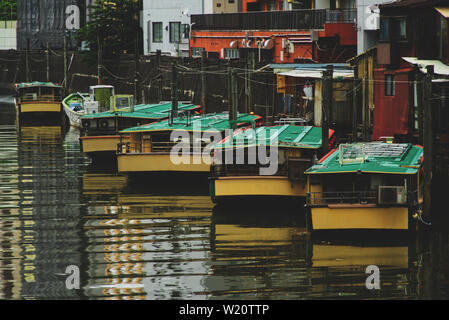 Yakatabune boats tied on the sumida river in tokyo Stock Photo