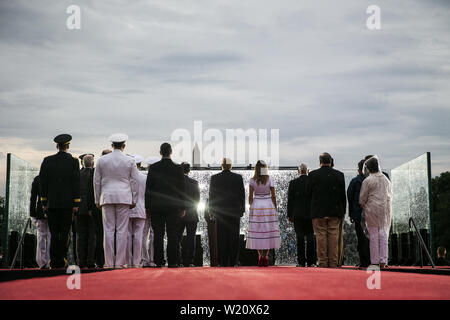 Washington, District of Columbia, USA. 4th July, 2019. U.S. President Donald Trump and first lady Melania Trump watch with U.S. Vice President Mike Pence and guests as military planes fly overheard during the Fourth of July Celebration 'Salute to America' event in Washington, DC, U.S., on Thursday, July 4, 2019. The White House said Trump's message won't be political -- Trump is calling the speech a ''Salute to America'' -- but it comes as the 2020 campaign is heating up. Credit: Al Drago/Pool via CNP Credit: Al Drago/CNP/ZUMA Wire/Alamy Live News Stock Photo