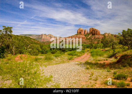 Red Rocks Of Sedona. Scenic Sedona, Arizona red rock landscape with the famous Courthouse and Bell mountain geological formations under a  blue sky. Stock Photo