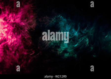 Colored background with winding clouds of smoke from patterns of different forms of pink, green and blue colors with tongues of flame on a black isola Stock Photo
