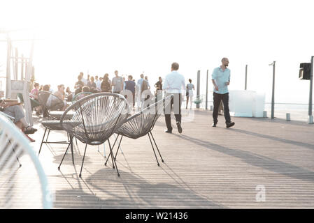 2 empty seats at a party on the rooftop of the Grande Arche La