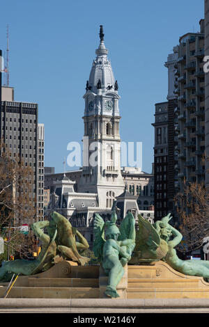 city hall in centr city Philadelphia seen in the background over the Swann Memorial Fountain in Logan Circle on the Benjamin Franklin Parkway; Stock Photo