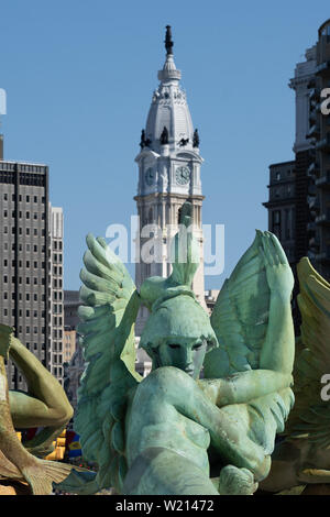 city hall in centr city Philadelphia seen in the background over the Swann Memorial Fountain in Logan Circle on the Benjamin Franklin Parkway; Stock Photo