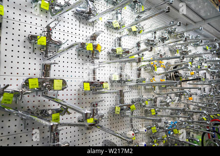 Chelyabinsk Region, Russia - JUNE 2019. Sale of mixers and taps. Showcase in the store with faucets for the kitchen and bathroom Stock Photo