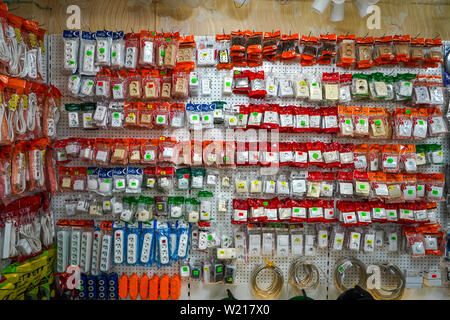 Chelyabinsk Region, Russia - June 2019. Electrical goods store. Variety of electrical appliances packed in packages are displayed on the shelf for sal Stock Photo