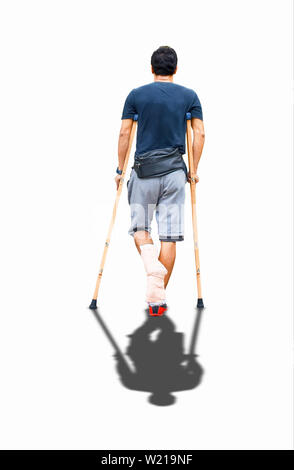 Isolated Asian man used wooden crutches walks on a white background with clipping path. Stock Photo