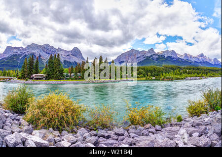 Canmore's Bow River Loop Trail on the southern Banff range of the Canadian Rockies in Alberta with Ehagay Nakoda, Ha Ling Peak and Mt Rundle in the ba Stock Photo
