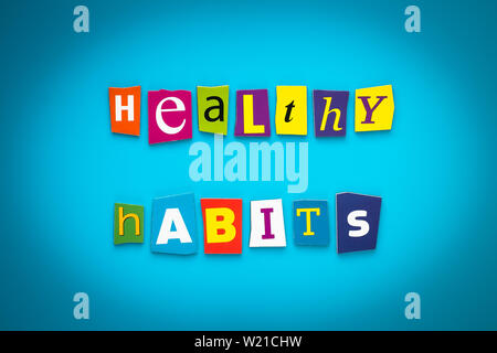 A word writing text - healthy habits - from cut letters on a blue background. Headline, card, banner with inscription. Psychologic, health concept. Ca Stock Photo