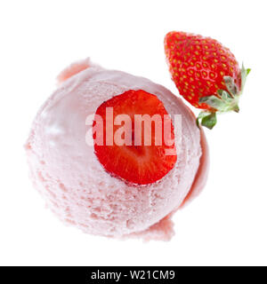 a single strawberry ice cream scoop from the top with strawberries and a strawberry slice on white background Stock Photo