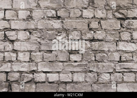 Vintage grey brick wall texture. White old cement wall background. Pattern with gray dilapidated bricks. Blank concrete grunge wall for decoration des Stock Photo