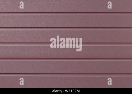 Soft pink striped steel surface. Strip pattern on the metal door. Reflecting metallic cladding of wall, texture. Ribbed rose-color background. Iron su Stock Photo