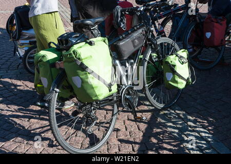 Bicycle bags for long journeys on the background of paving stones Stock Photo