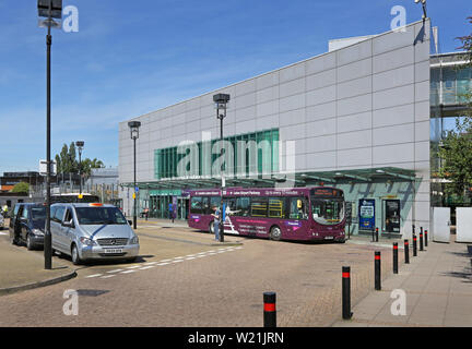 Luton Airport, London. Passengers at Luton Airport Parkway Station wait for the shuttle bus to the airport terminal. New DART rail link opens in 2021. Stock Photo