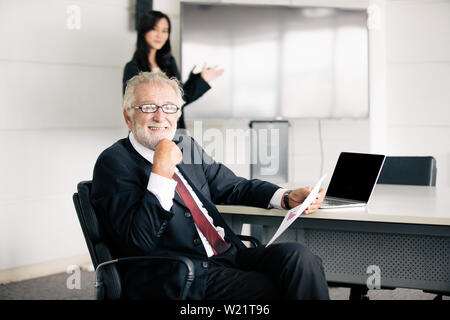 businessmen holding documents for business partners discussing  and share ideas at meeting and business women smiling happy for working Stock Photo